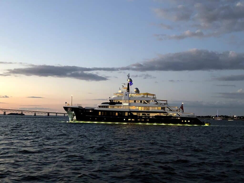 yacht departing from Newport harbor as seen from the madeleine sailing tour