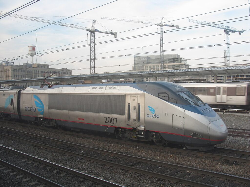 amtrak acela train leaving the station
