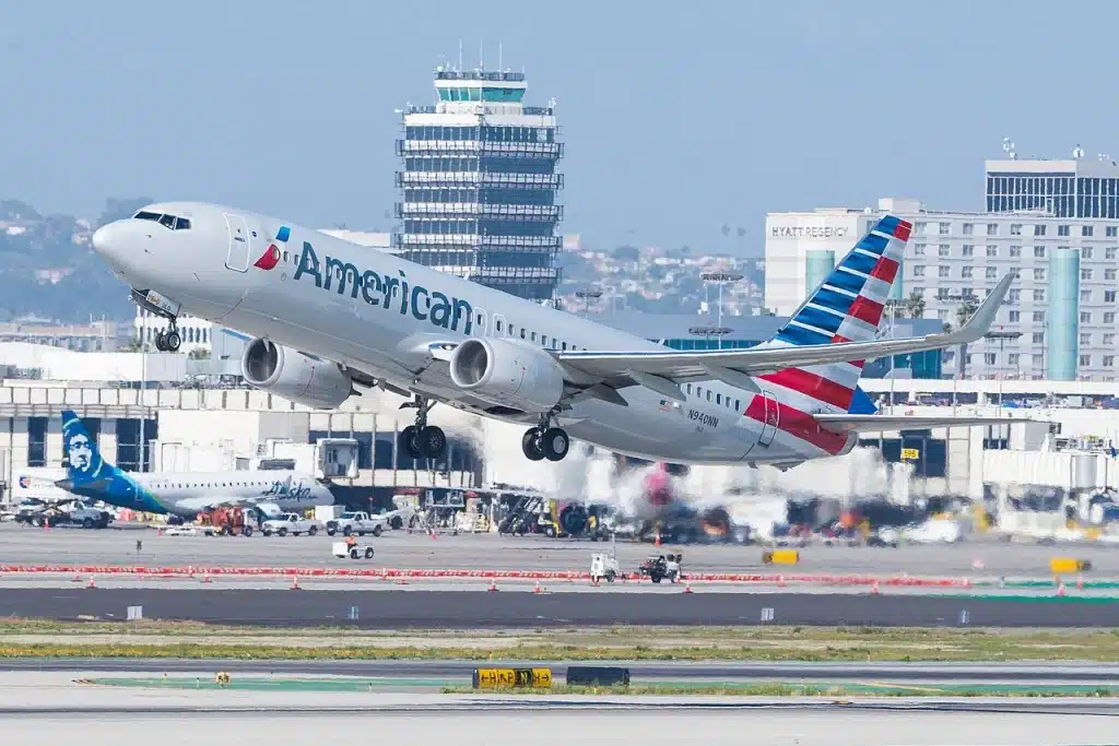 An American Airlines Boeing 737-800 takes off from a runway.