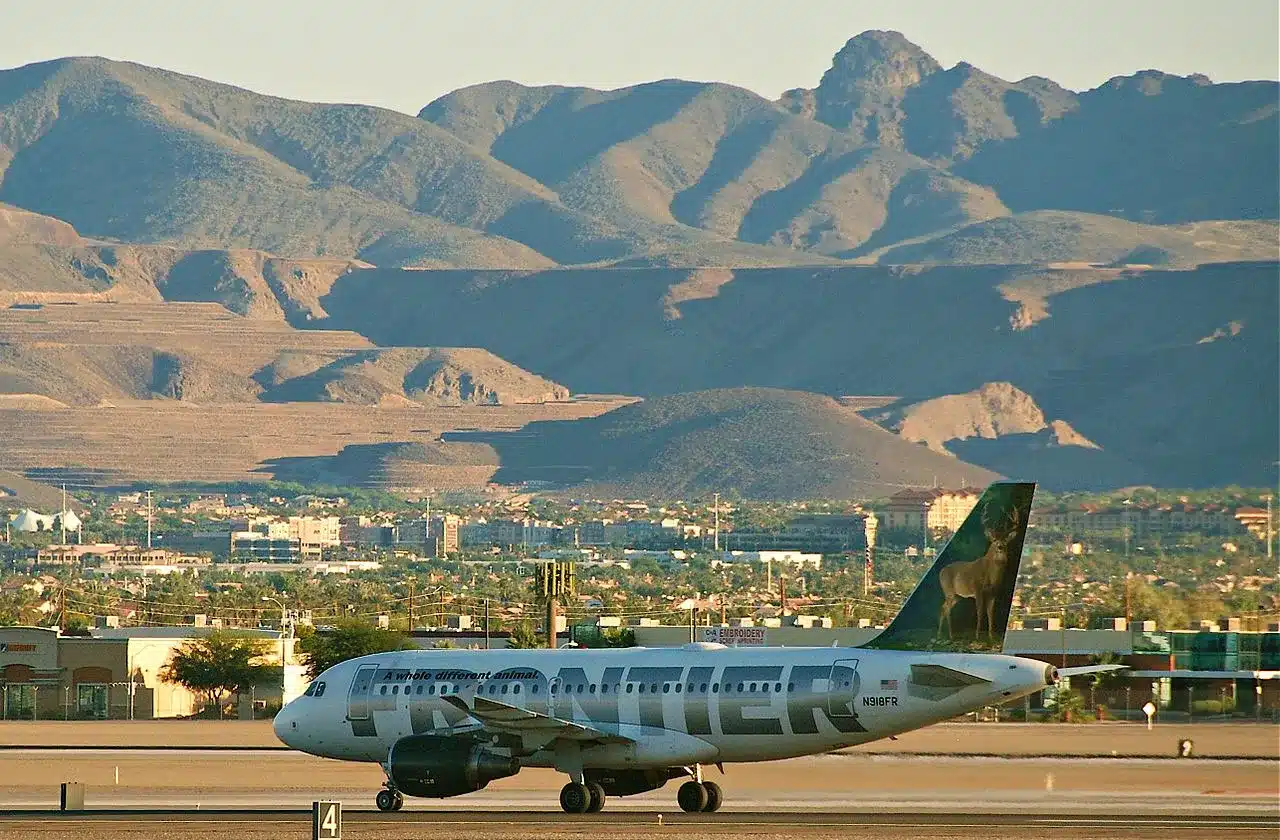 Frontier Airlines Airbus A319 taxing past some nice terrain.