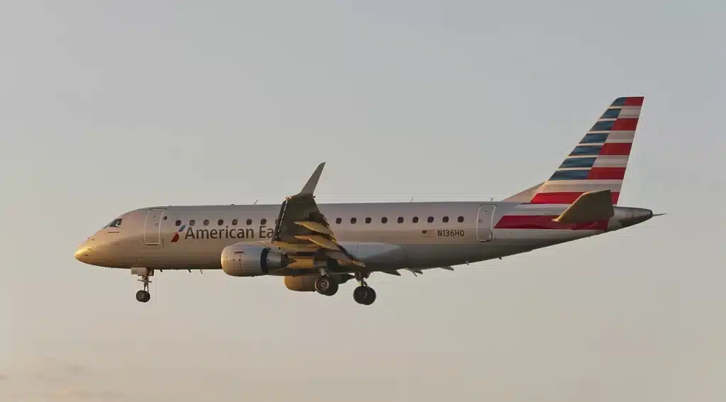 An American Eagle Embraer 175 coming in for a sunset landing.
