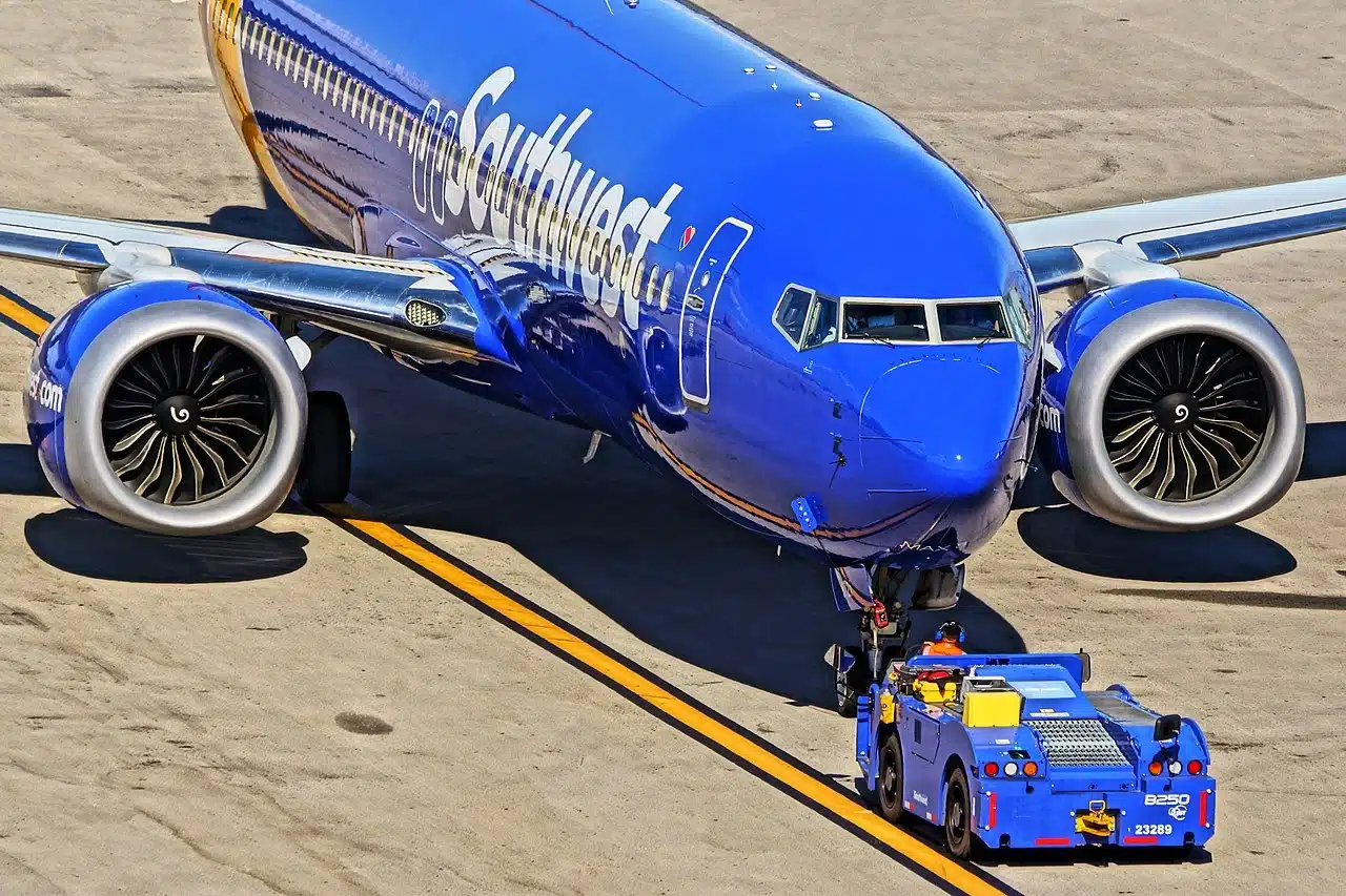 Southwest Airlines Boeing 737 Max 8 being pushed back by a tug.