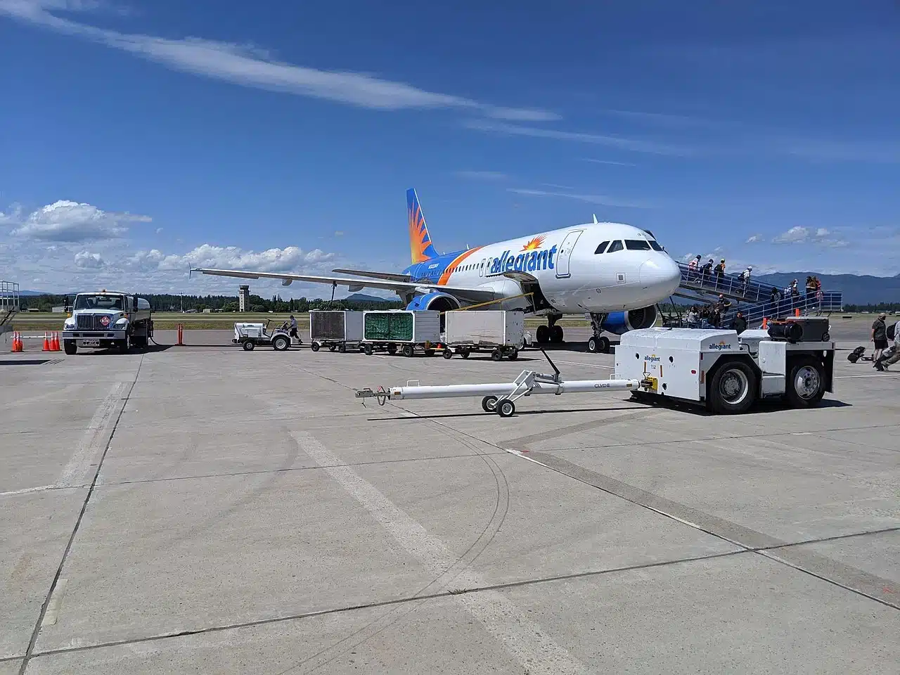 Allegiant Air Airbus A320 boarding passengers at the ramp.