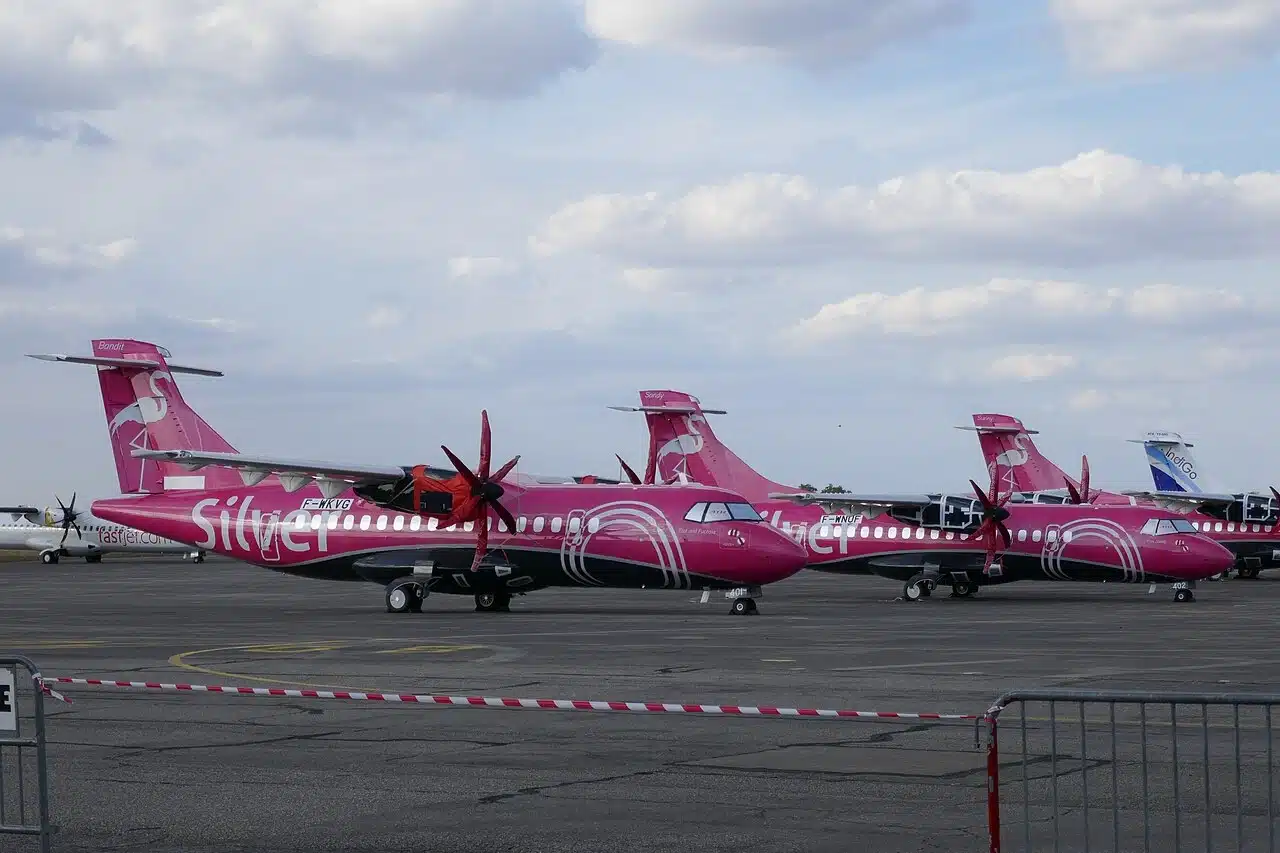 Silver Airways ATR-72 parked on the ramp.