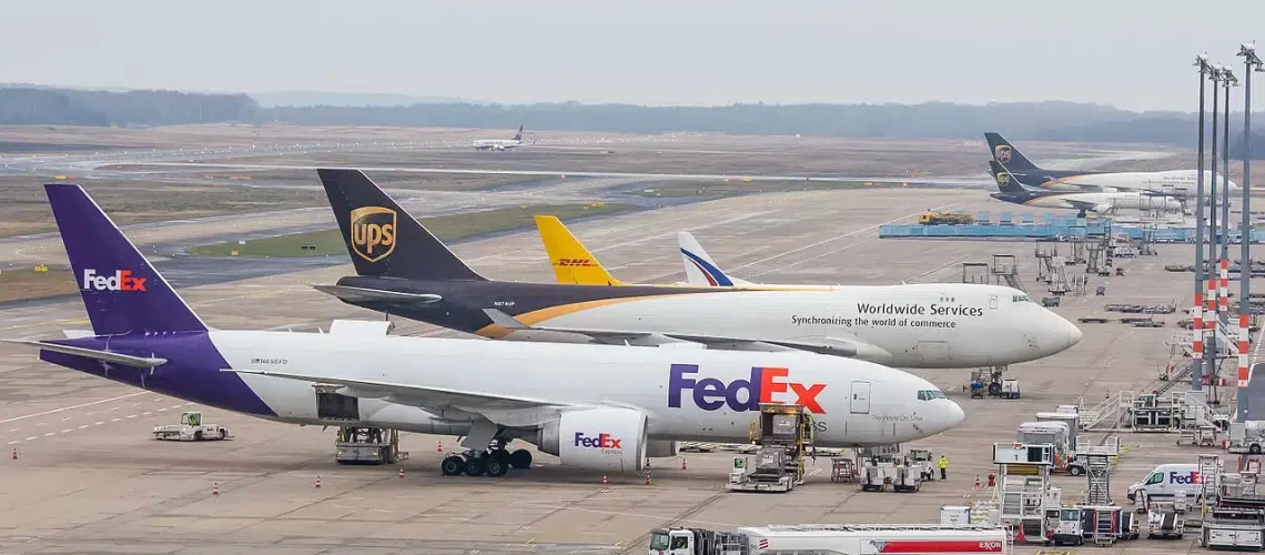 UPS Airlines & FedEx Express parked at the cargo ramp.