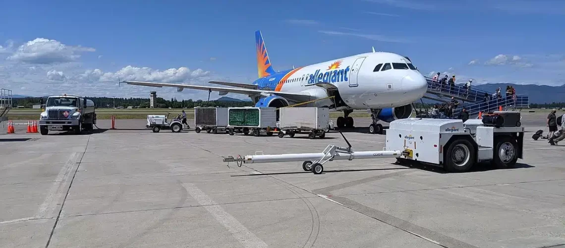 Allegiant Air Airbus A320 boarding passengers at the ramp.