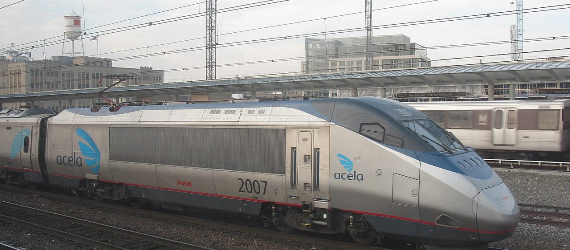 amtrak acela train leaving the station