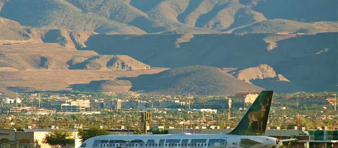 Frontier Airlines Airbus A319 taxing past some nice terrain.