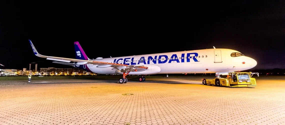 icelandair airbus a321lr being pulled into the ramp area.